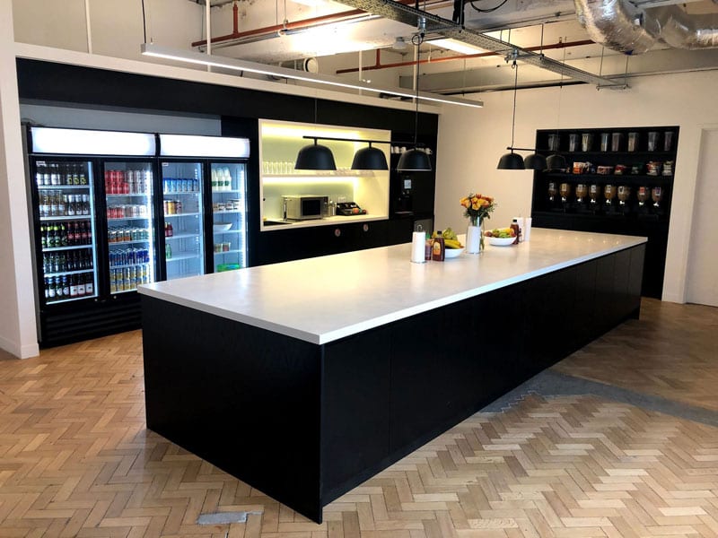The Cloudflare kitchen with drinks fridges and a central island for catering