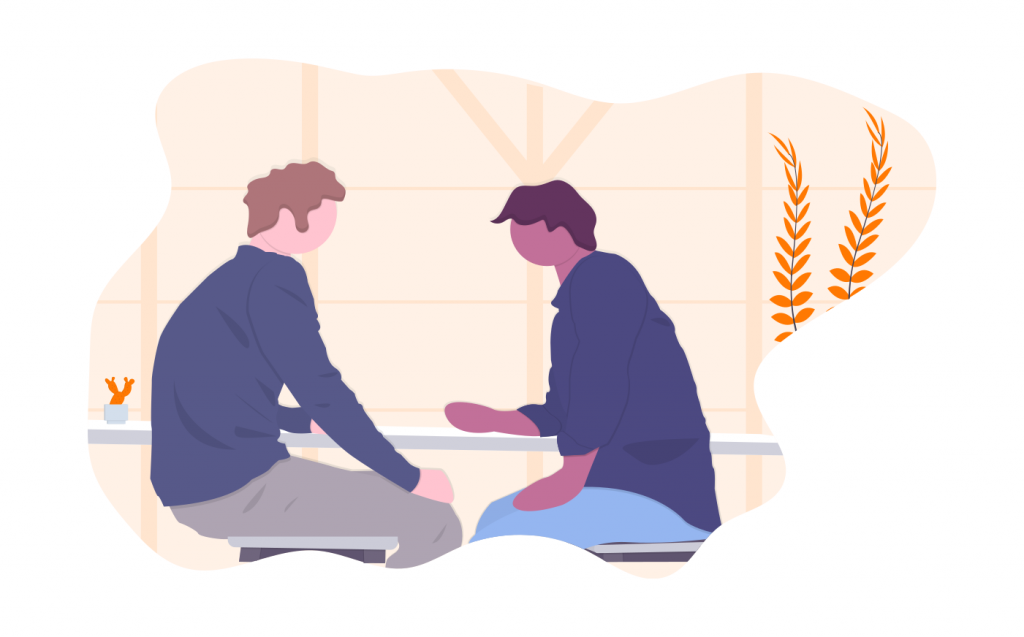 two people having a conversation at a table