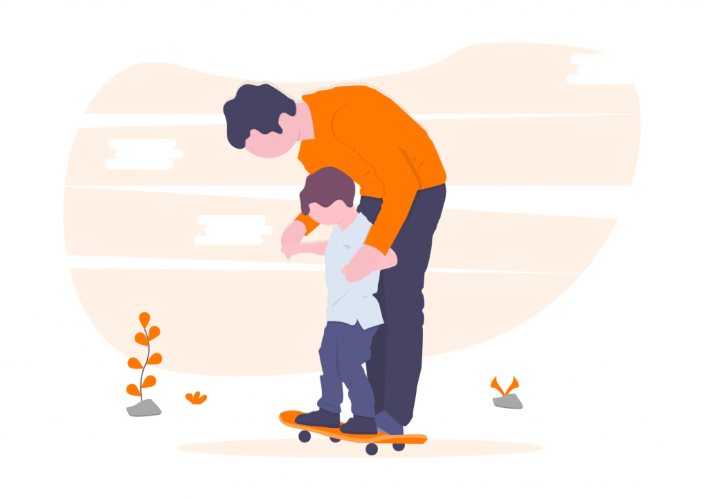 father teaching son to skateboard