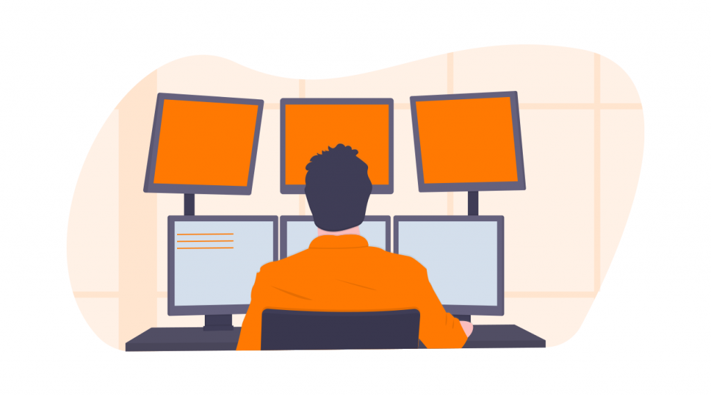 man in front of many computer screens